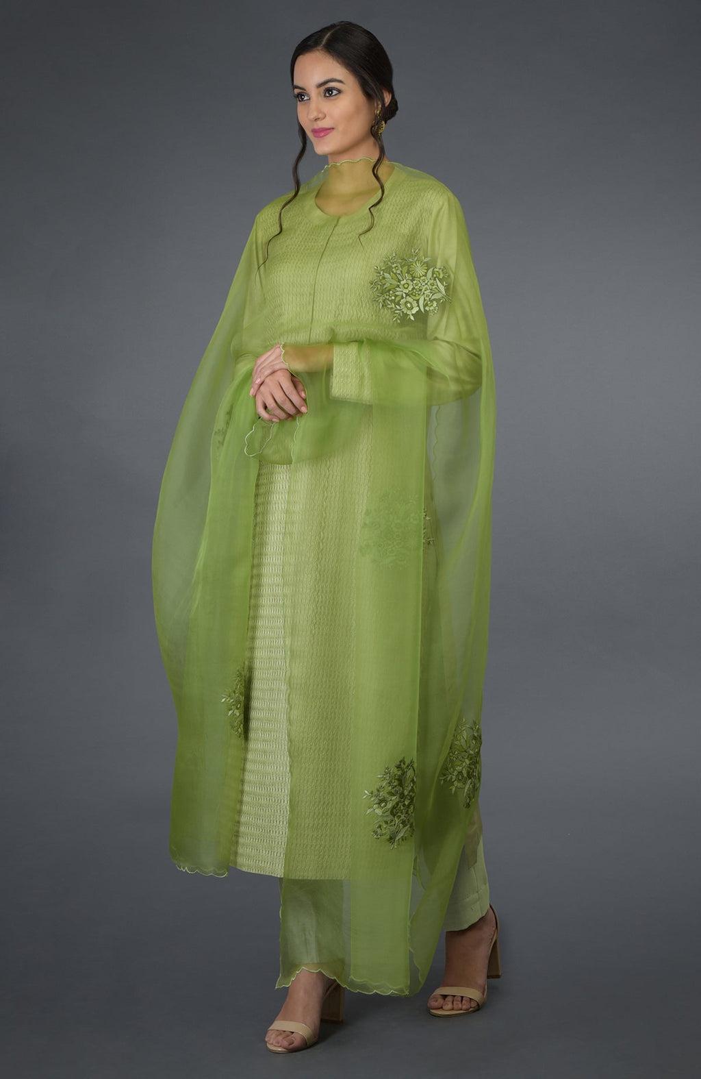 Pista green pintuck silk kurta set with an embroidered organza silk dupatta.