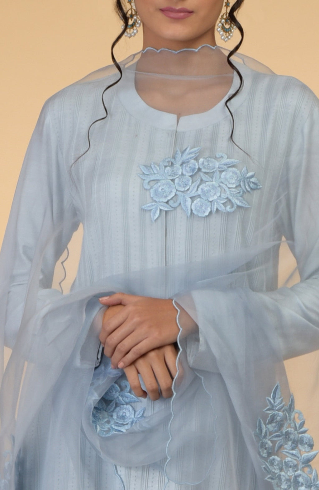 Powder blue pintuck and Kantha silk kurta set with embroidered organza dupatta.