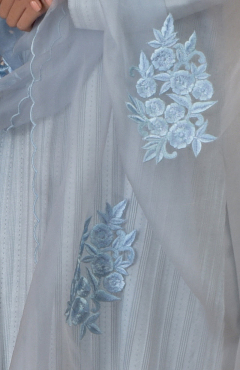 Powder blue kurta set with pintuck details, kantha embroidery, and a scalloped dupatta.