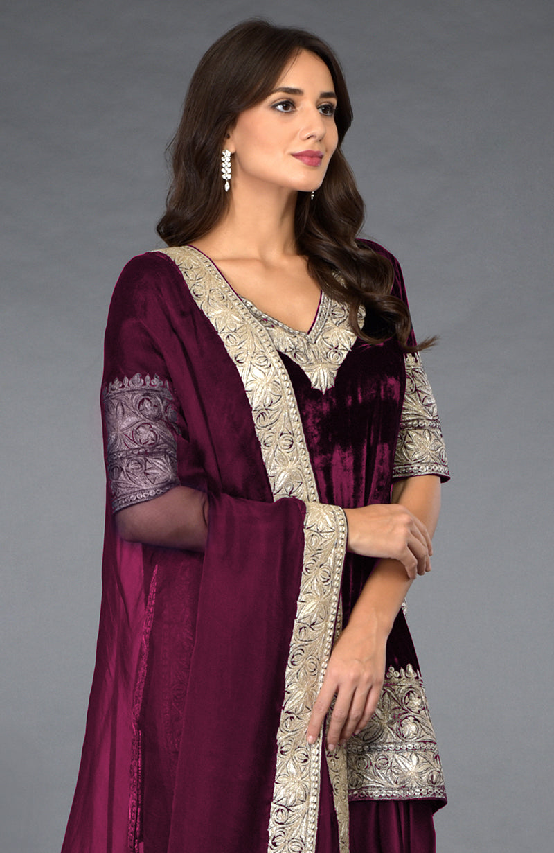 Burgundy velvet dhoti pants suit with silver tilla embroidery.