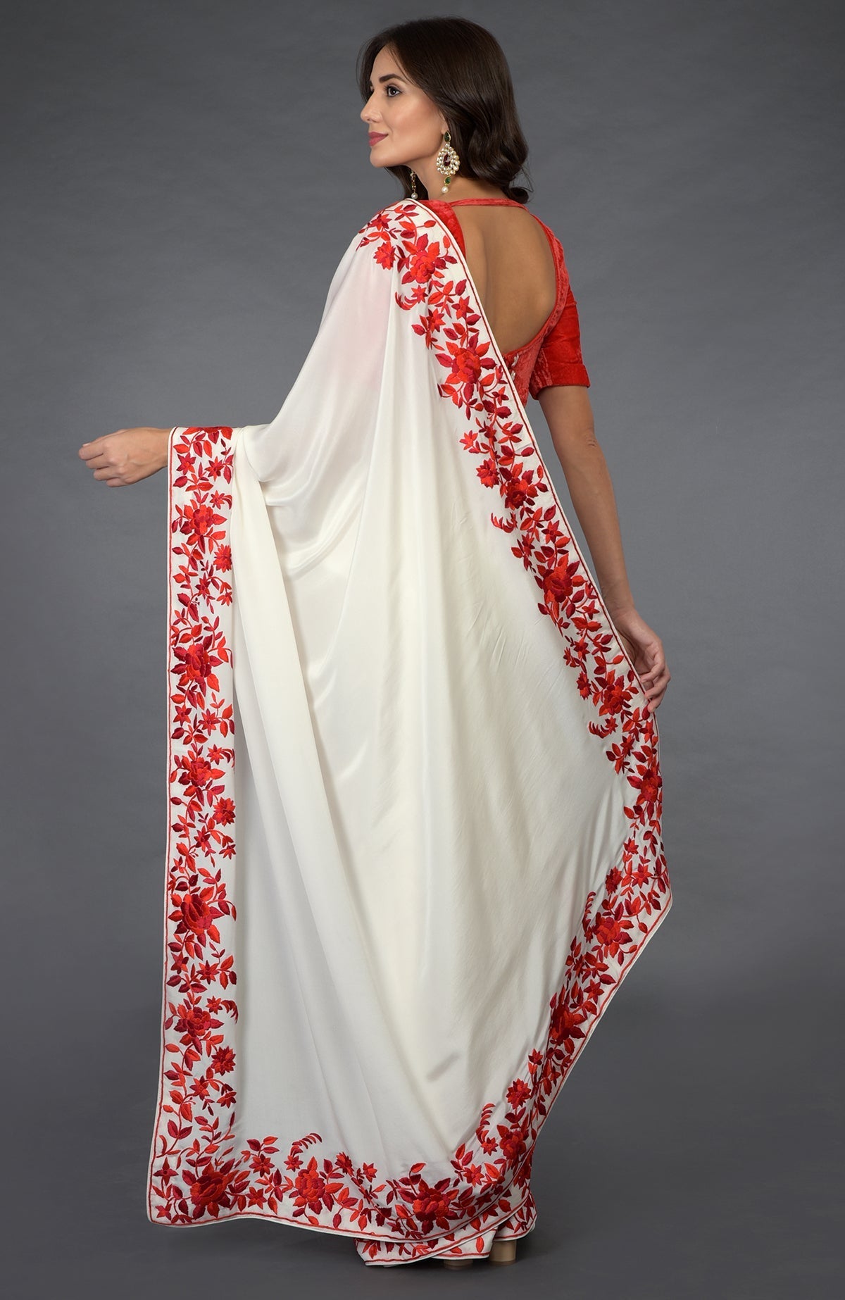 Ivory-red Parsi Gara hand-embroidered saree with floral borders.