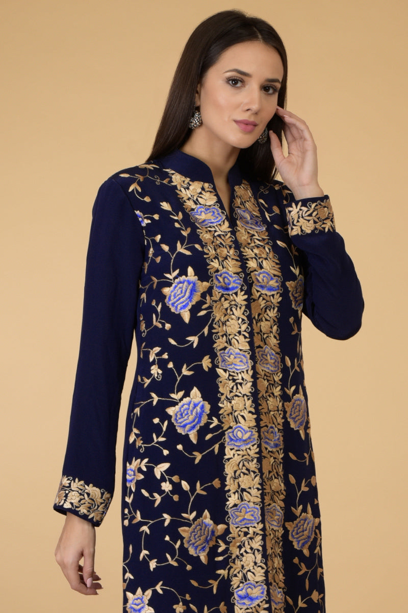 Midnight blue Parsi Gara jacket with floral embroidery, band collar, and matching pants.