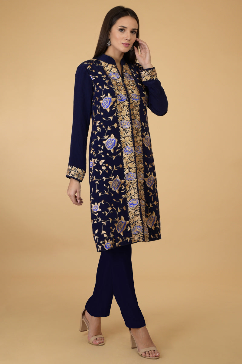 Midnight blue Parsi Gara jacket with floral embroidery, band collar, and matching pants.