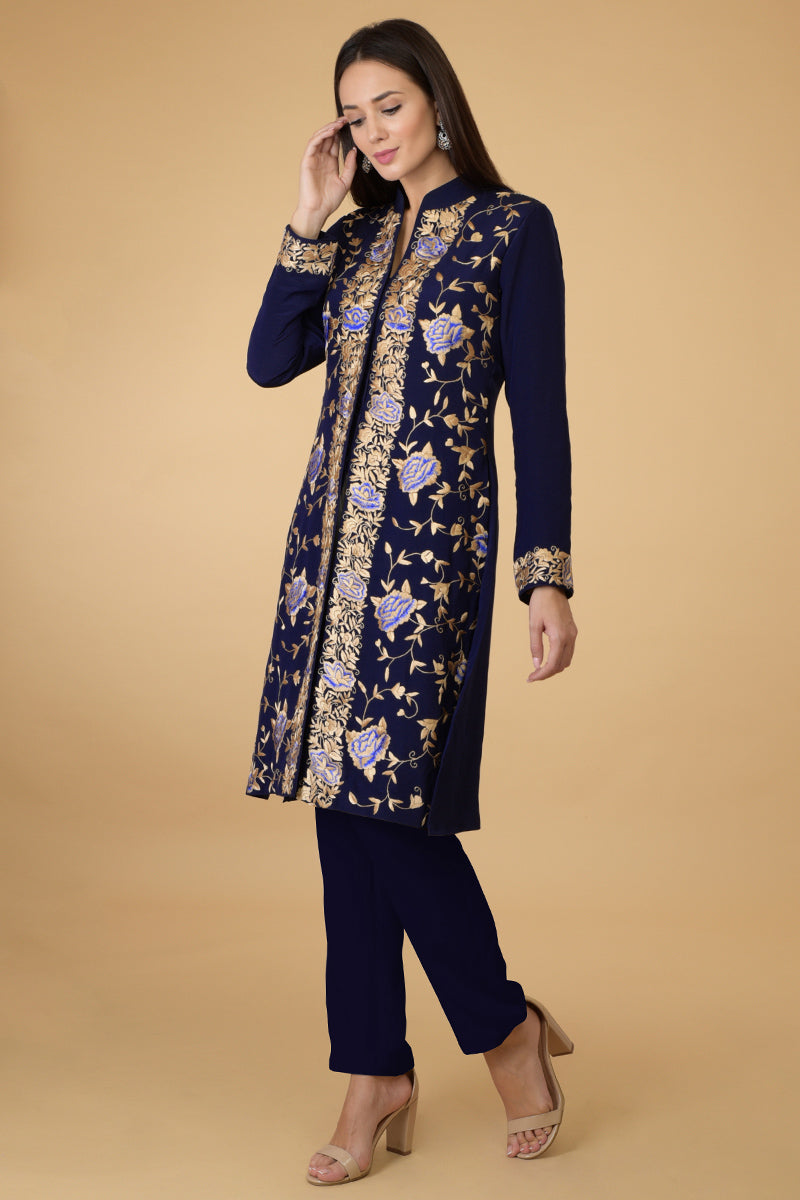 Midnight blue Parsi Gara jacket with floral embroidery, band collar, and matching pants set.
