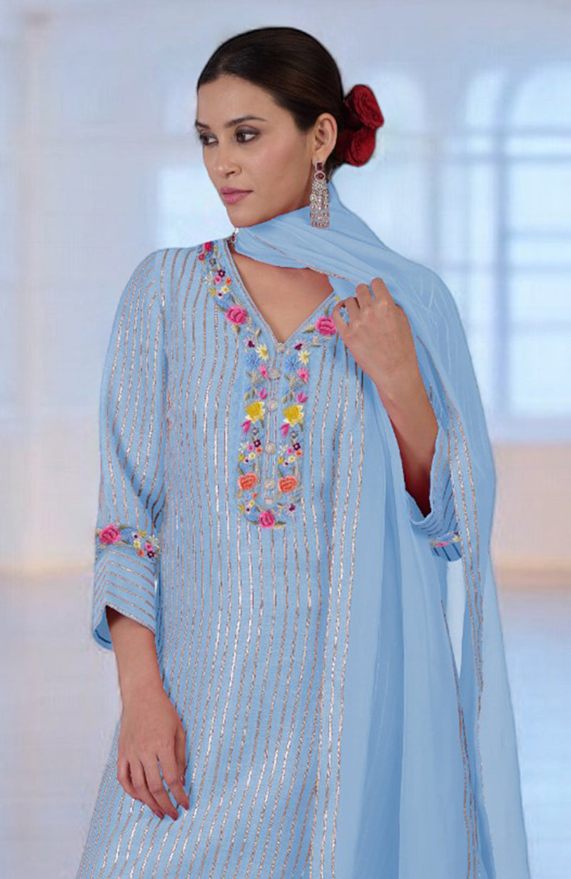 Cerulean blue silk linen suit with gota and Parsi Gara embroidery.
