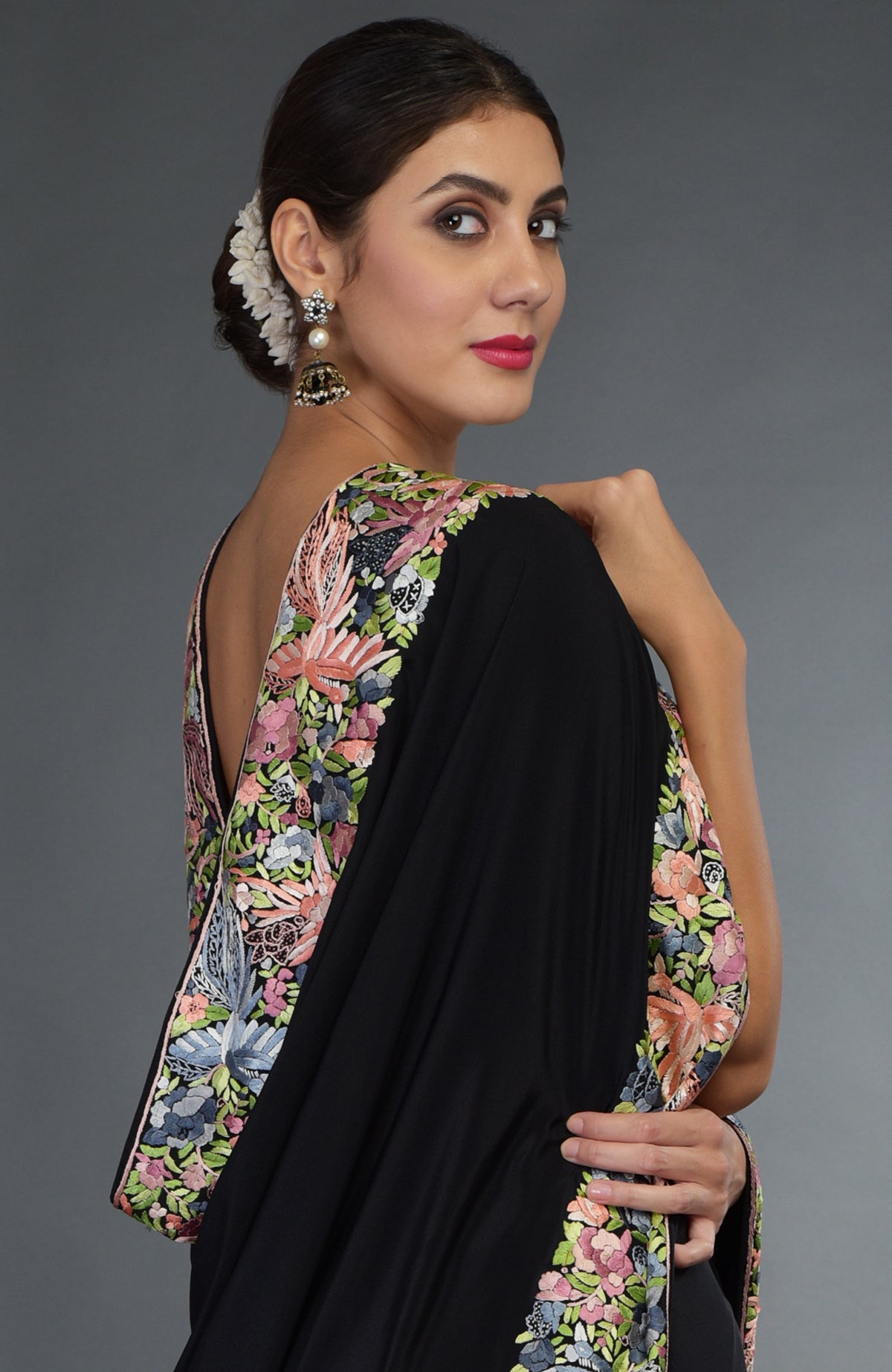 Black Parsi Gara hand-embroidered saree with colorful bird and floral motifs.