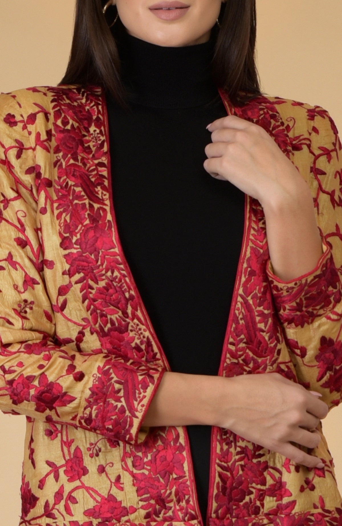 Fawn gold Parsi Gara embroidered tussar silk shrug jacket with red floral and bird motifs.