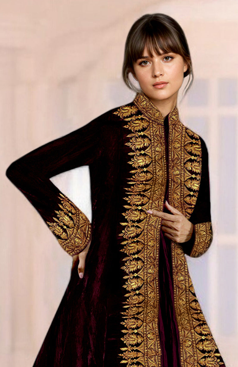 A woman models a maroon velvet jacket with gold Kashmiri Tilla embroidery.