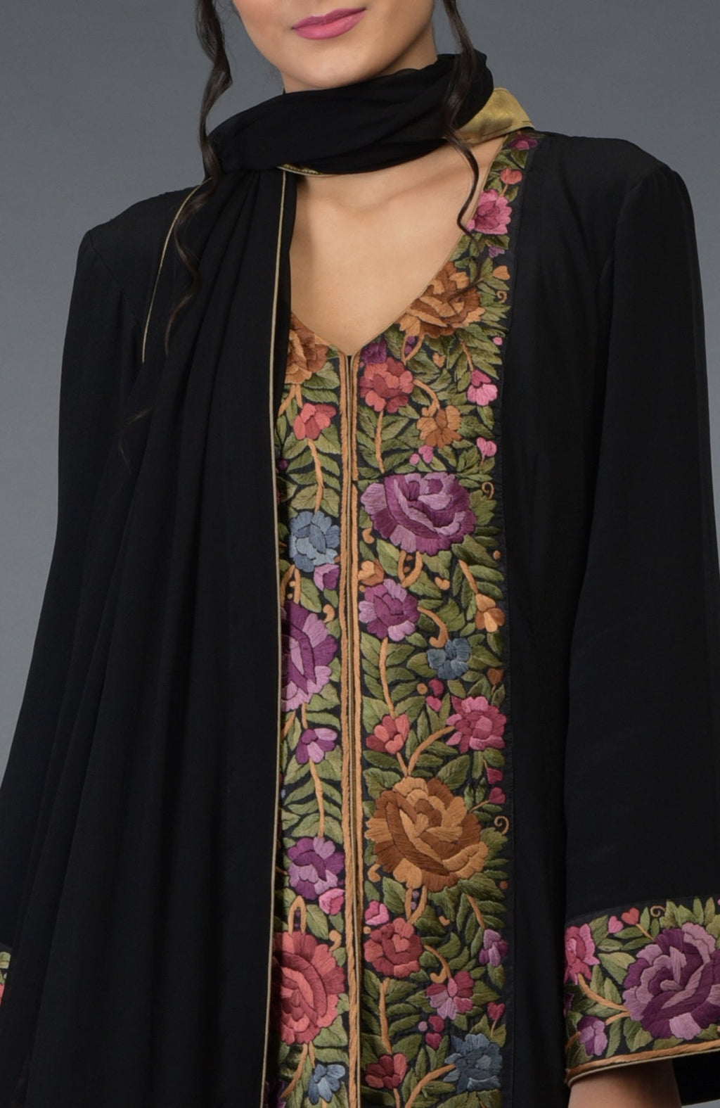 Black Anarkali suit with purple and green Parsi Gara embroidery and bell sleeves.