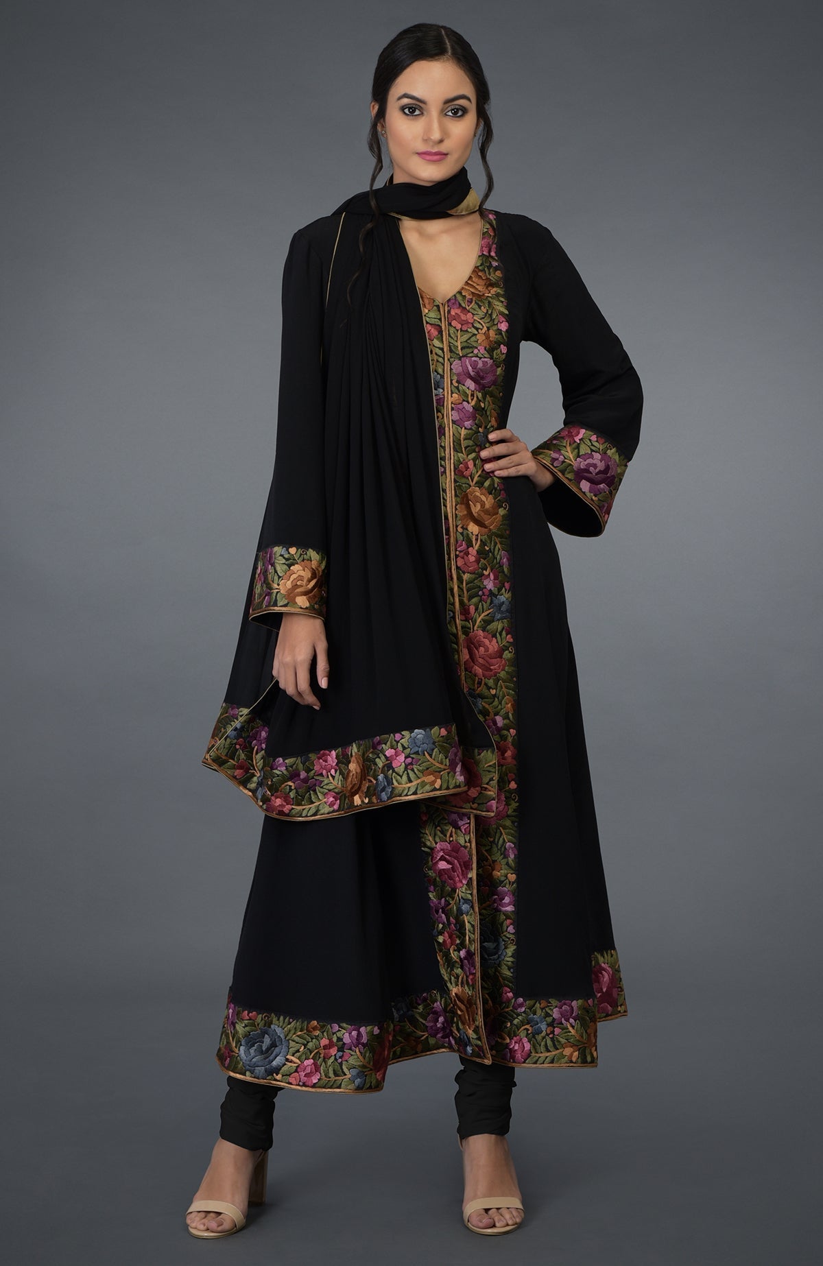Black Anarkali suit with purple and green Parsi Gara embroidery and bell sleeves.