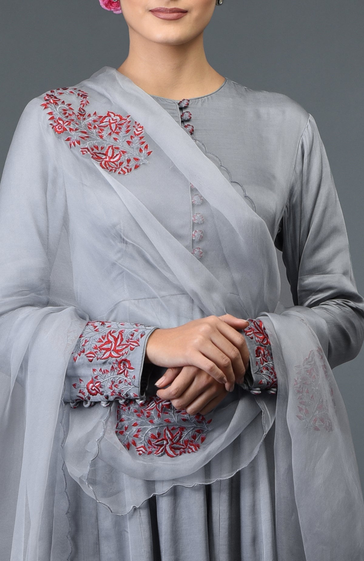 Grey paisley embroidered Anarkali suit with dupatta, featuring red floral embroidery.