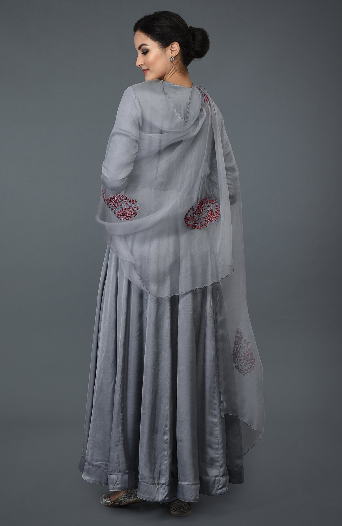 Grey paisley embroidered anarkali suit with dupatta, shown from the back.