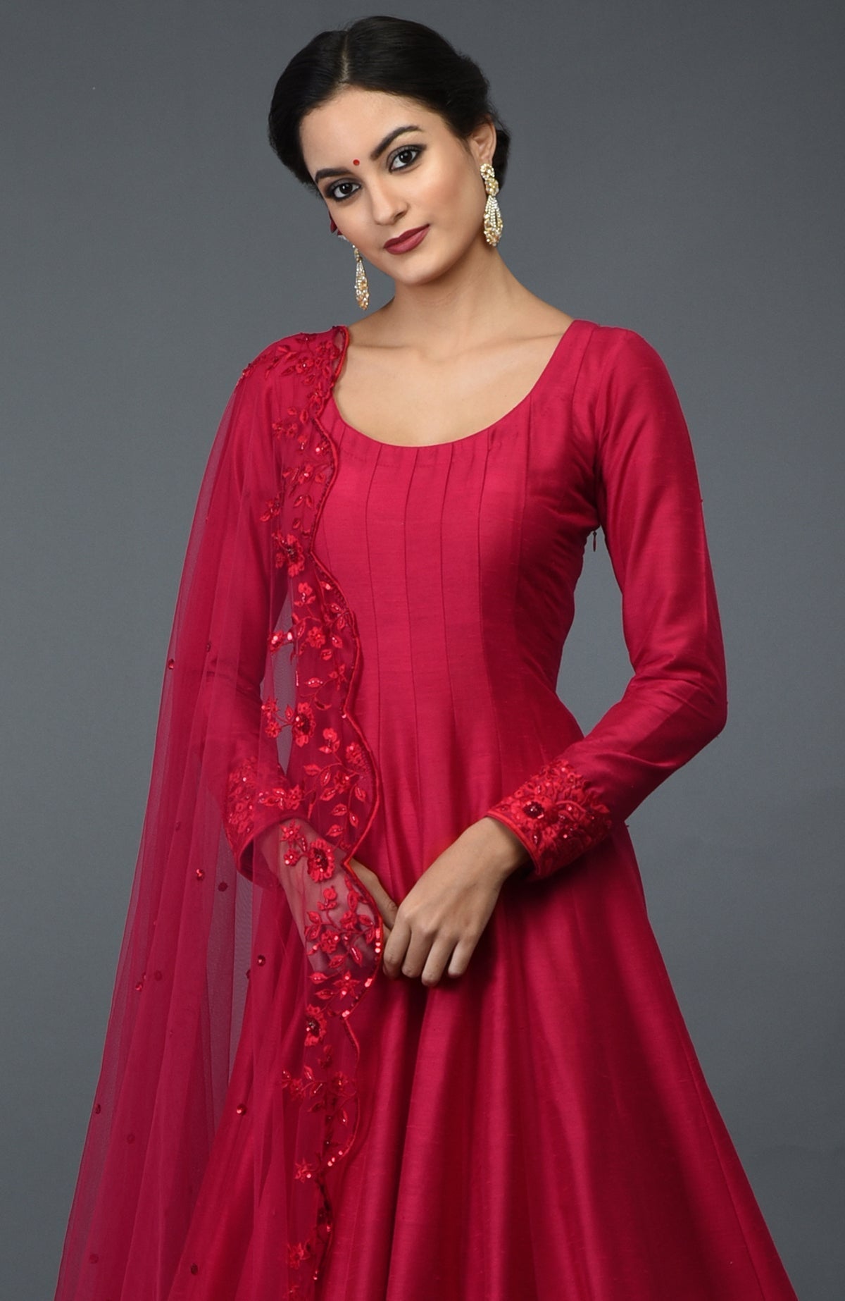 Carmine red anarkali gown with floral resham, sequin, and bead embroidery.
