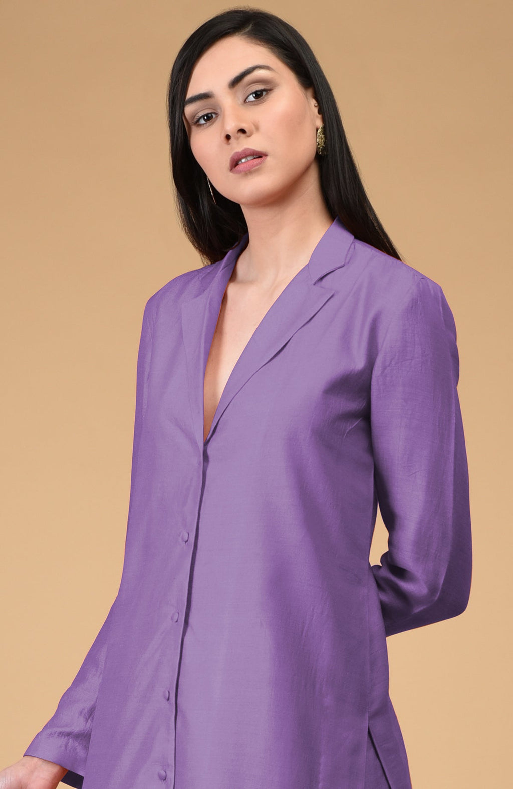 A woman models an amethyst orchid notch collar kurta set.