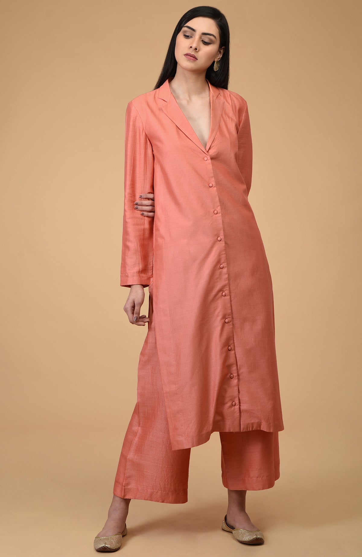 Amethyst Orchid notch collar kurta set with wide-leg pants and gold juttis.