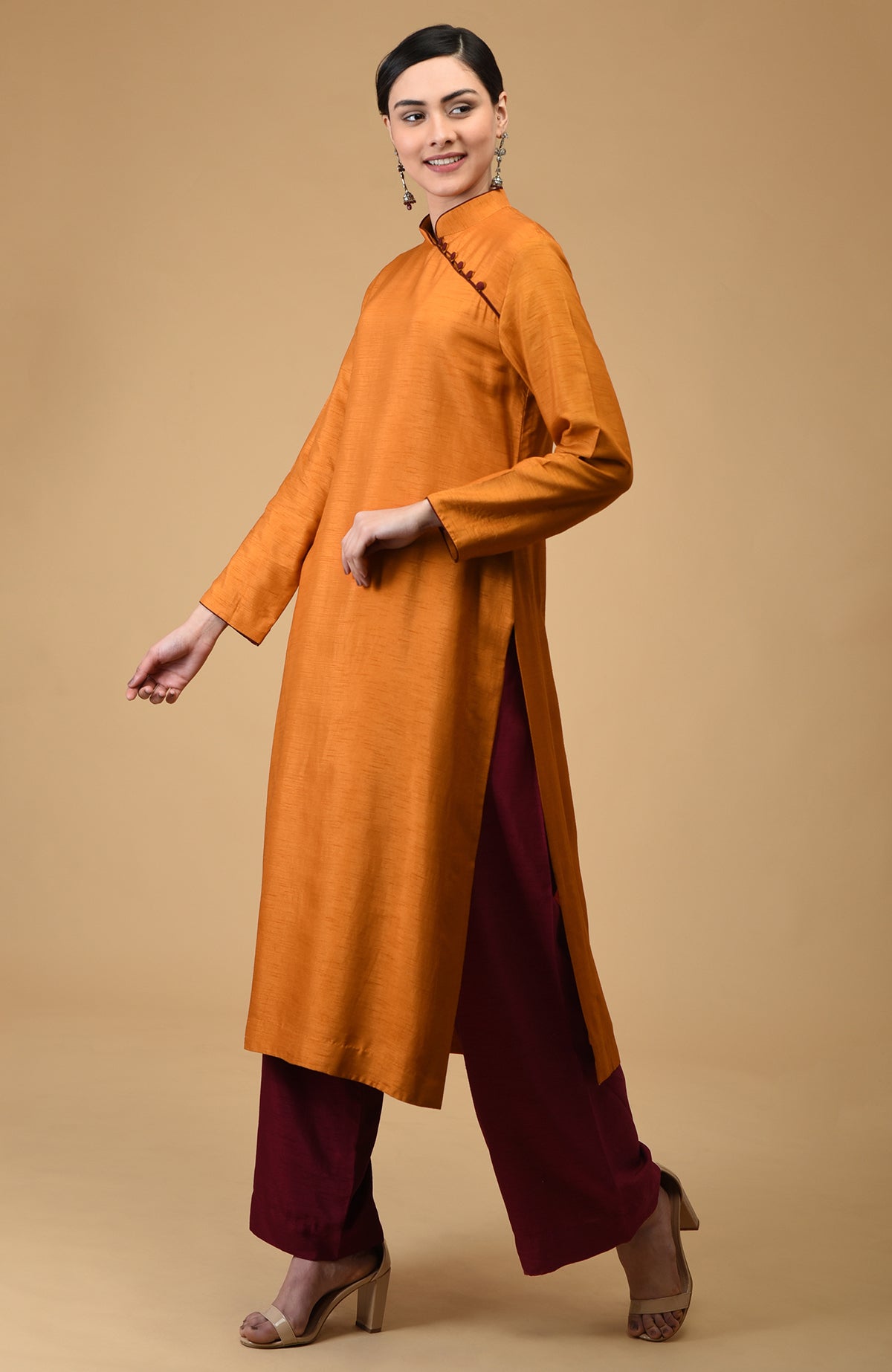 Mustard-maroon mandarin collared kurta set with wide-leg pants.