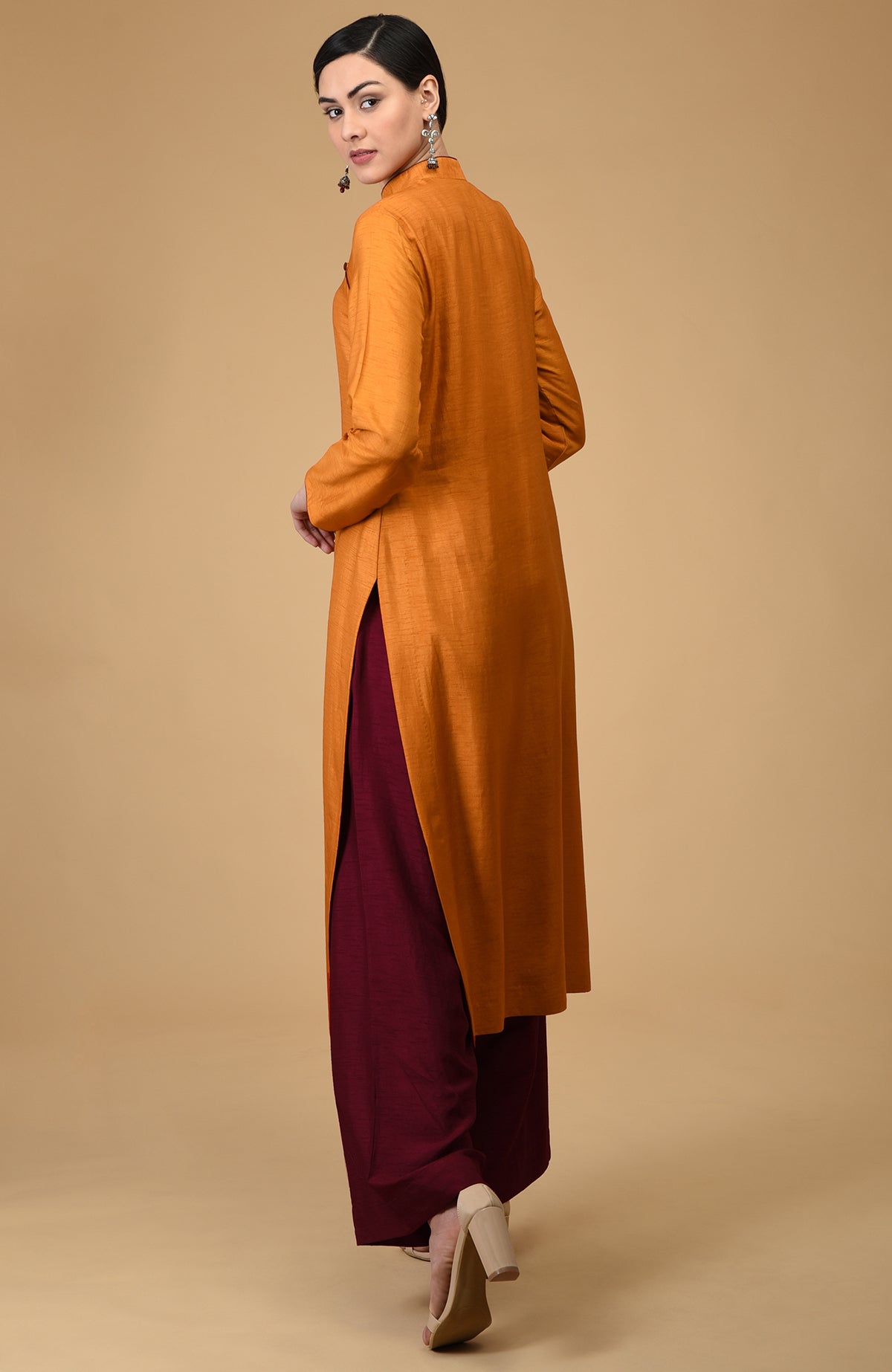 Mustard-maroon mandarin collared kurta set with wide-leg pants.