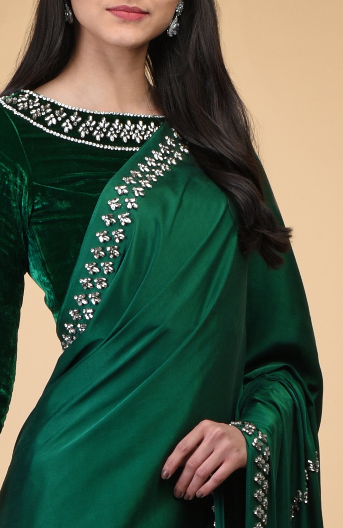 Emerald green velvet blouse with crystal embroidery on the neckline and sleeves.