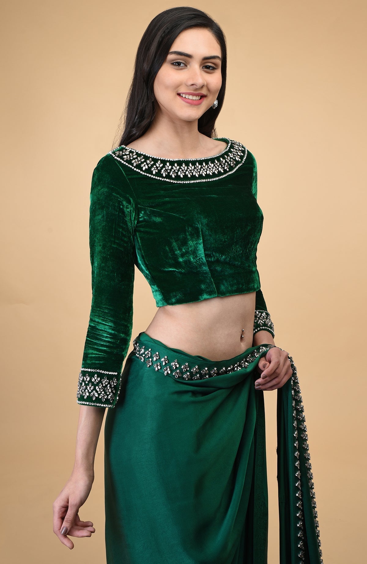Emerald green velvet blouse with crystal embroidery on the neckline and sleeves.