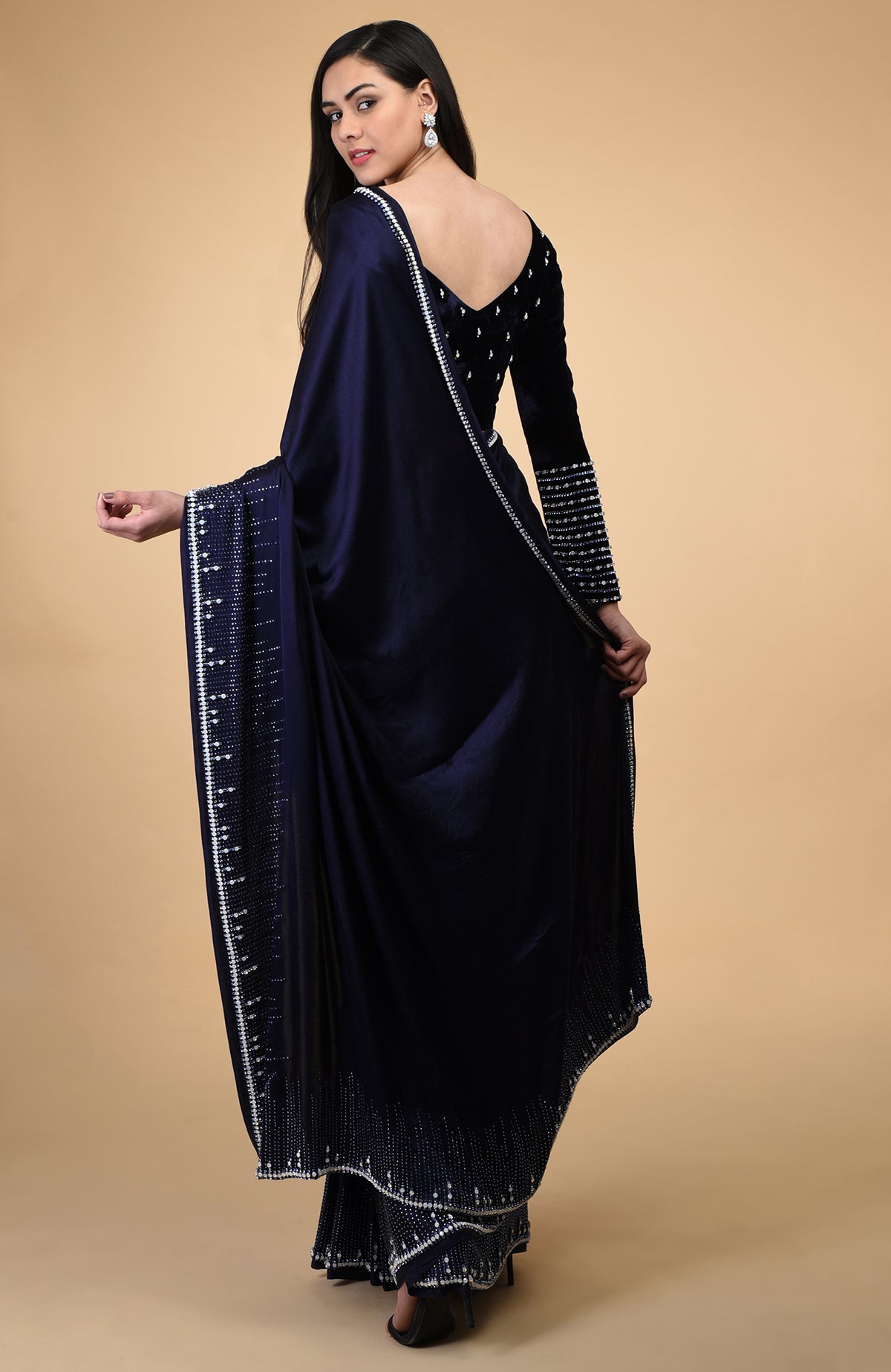 Midnight blue velvet blouse with crystal embroidery and a deep V-neck.