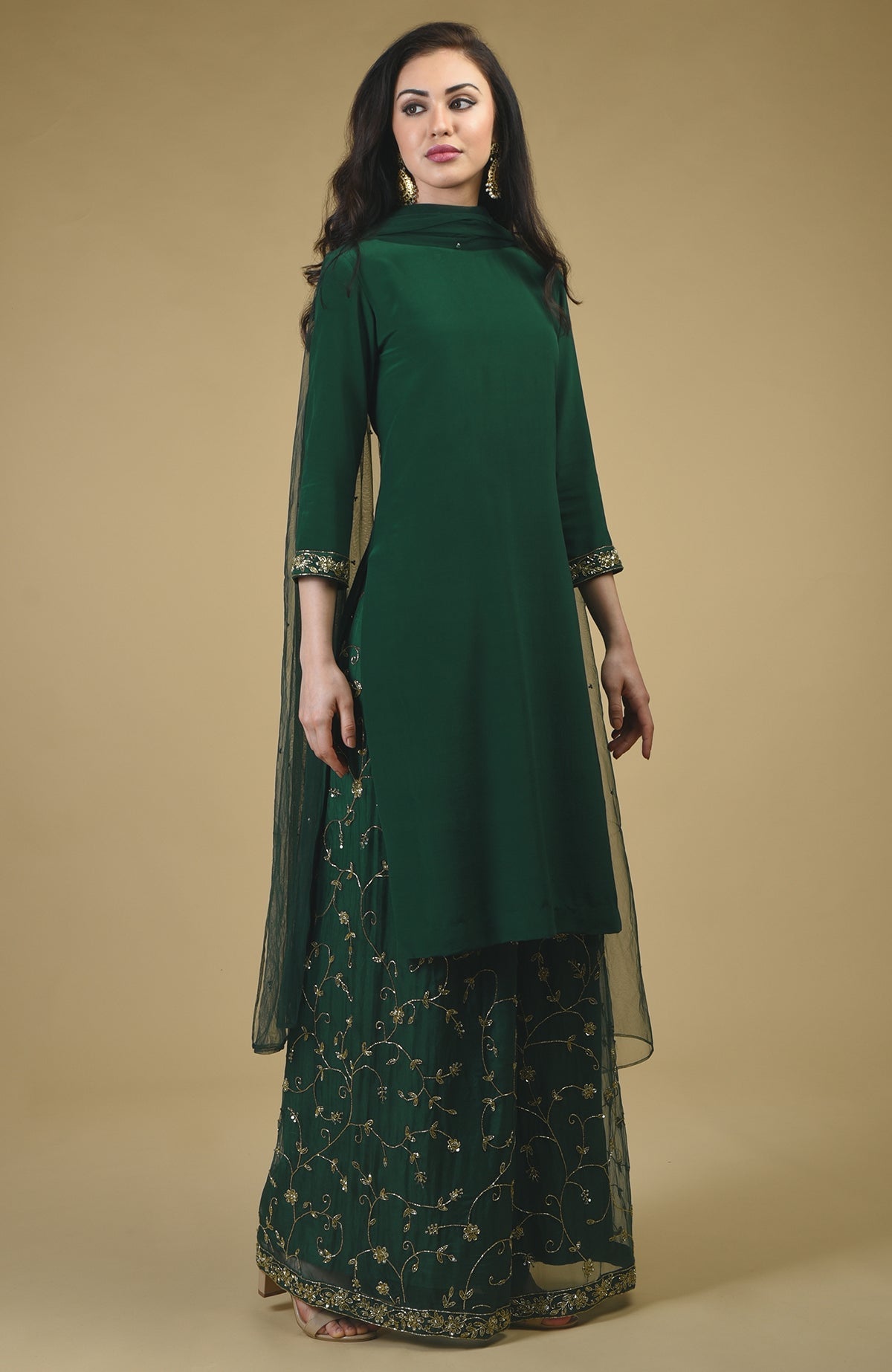 Emerald green sharara suit with gold bead and sequin zardozi hand embroidery.