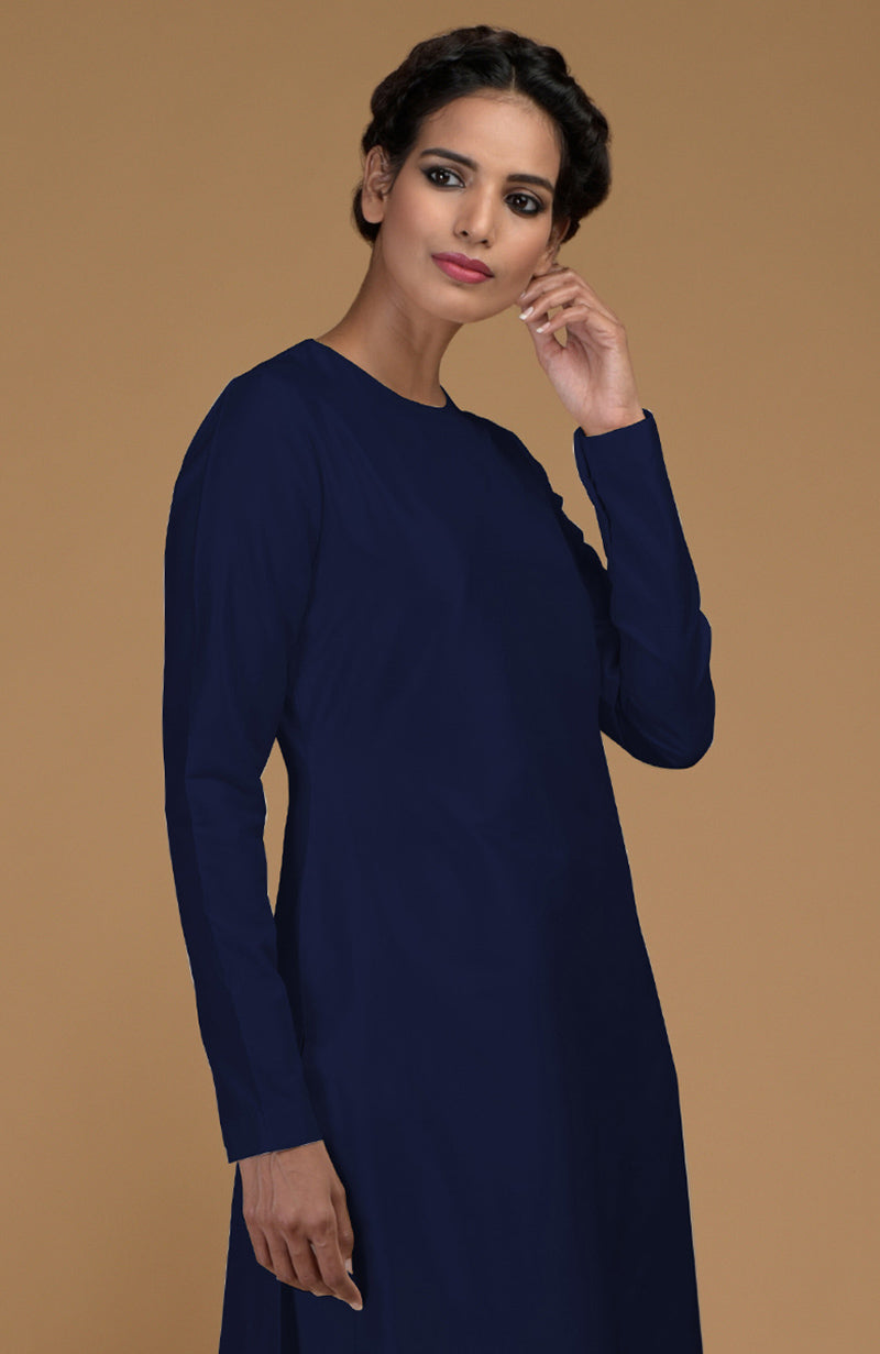 A woman models a navy blue pure Matka silk jewel neck kurta.