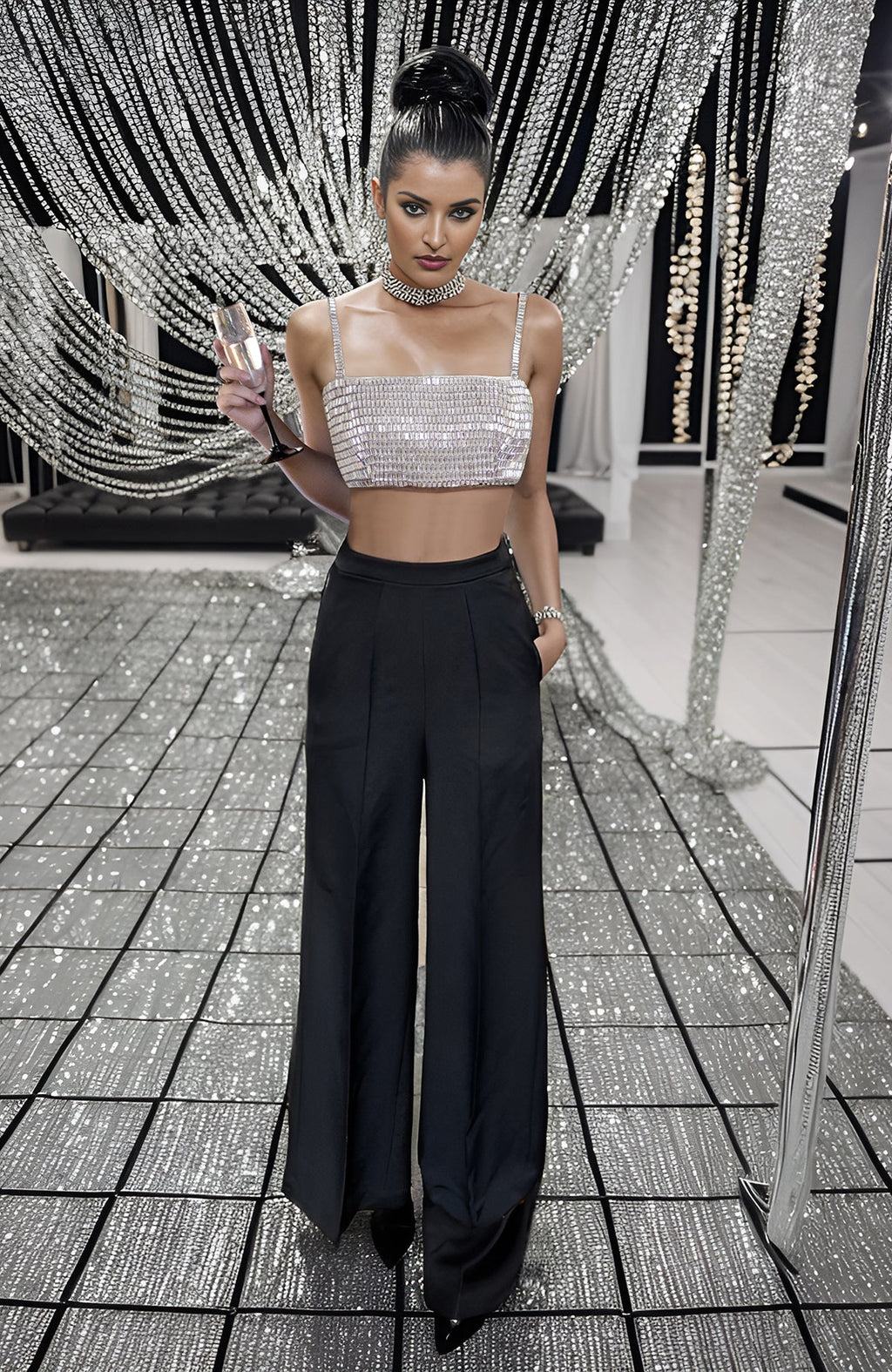 Black corset with hand-embroidered diamante crystals paired with high-waisted white pants