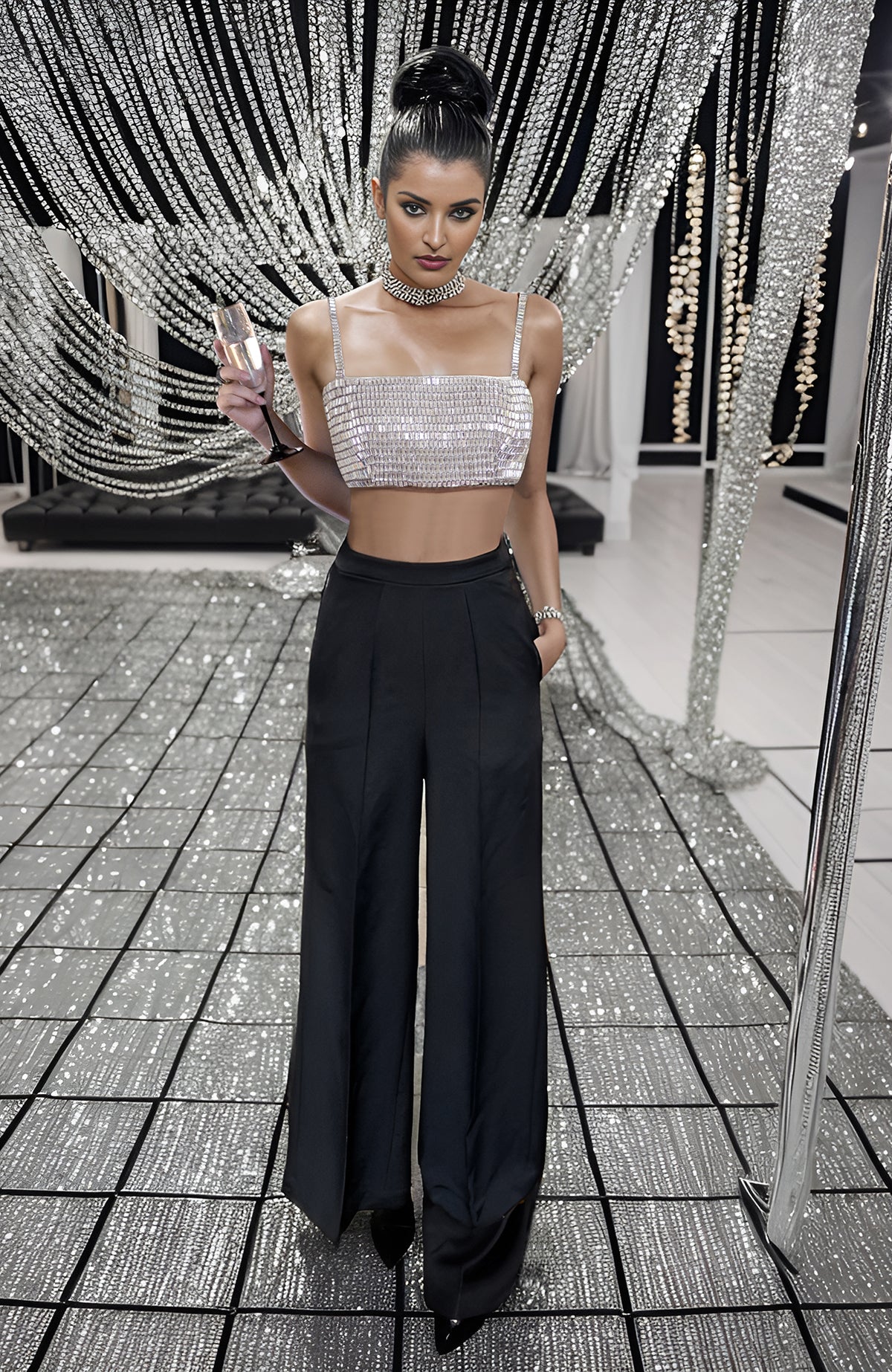 Black corset with hand-embroidered diamante crystals paired with high-waisted white pants