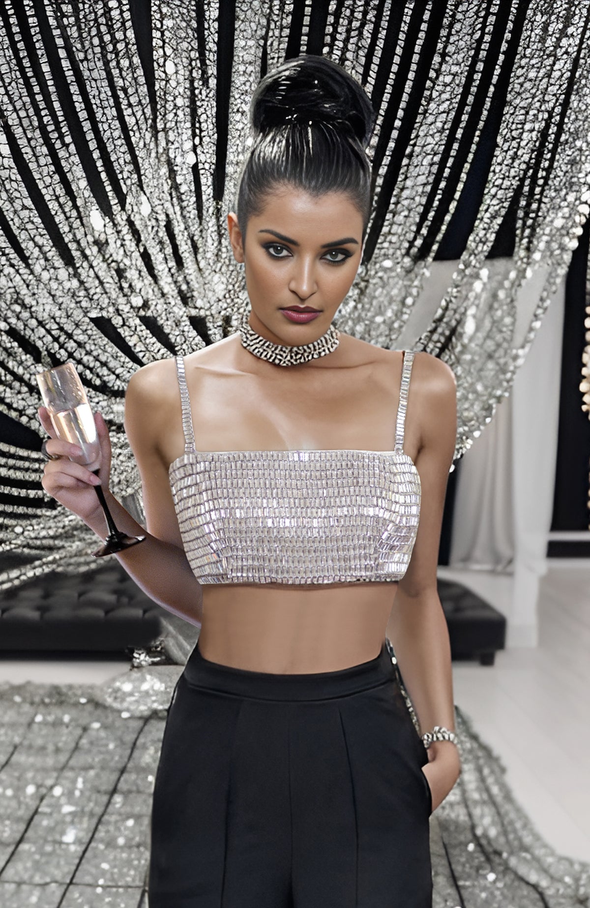 Black corset with hand-embroidered diamante crystals paired with high-waisted white pants