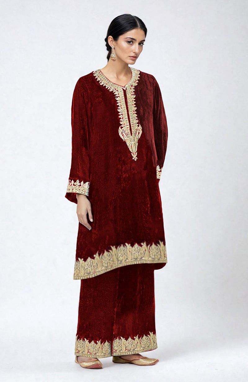 Maroon velvet pheran kurta set with Kashmiri tilla dozi embroidery.