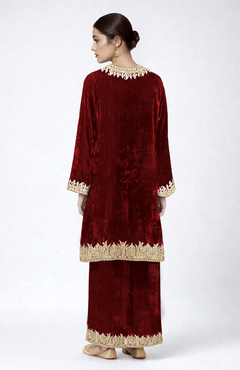 Maroon velvet Pheran kurta set with gold Kashmiri tilla dozi embroidery.