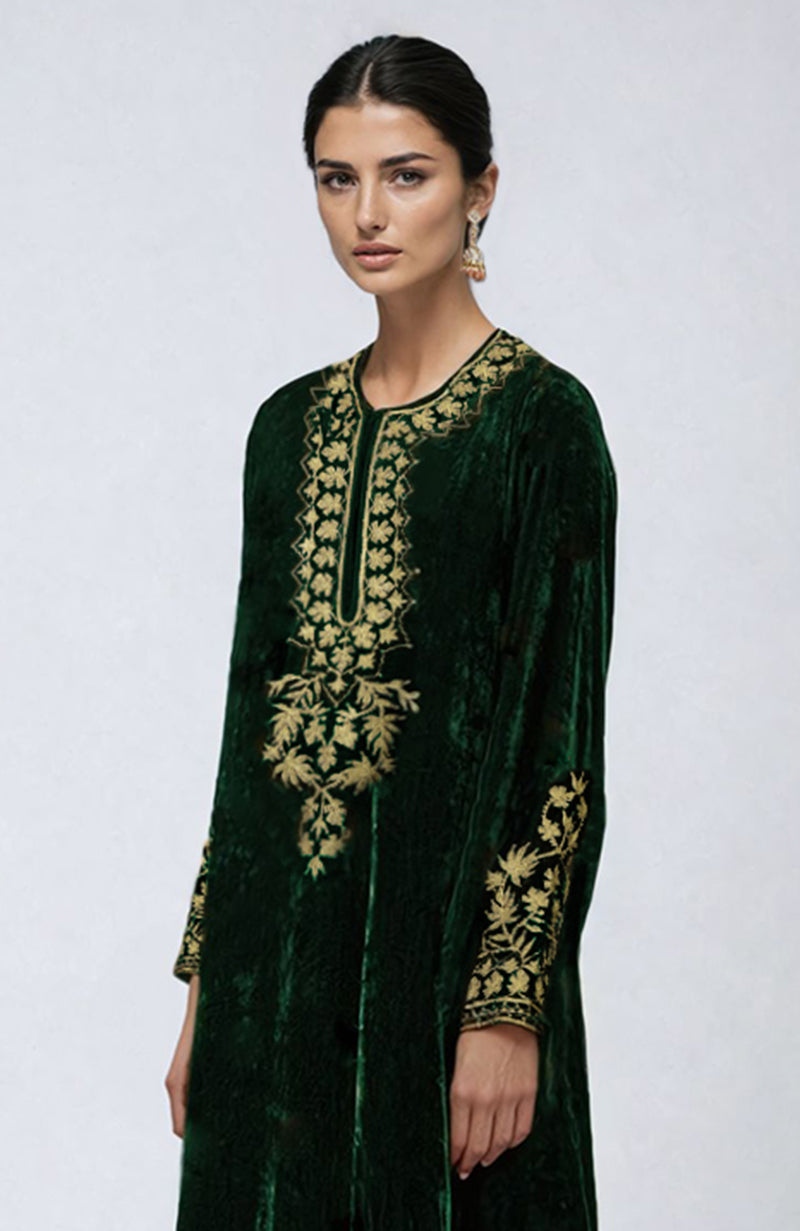 Emerald green velvet pheran kurta with gold Kashmiri tilla aari embroidery.