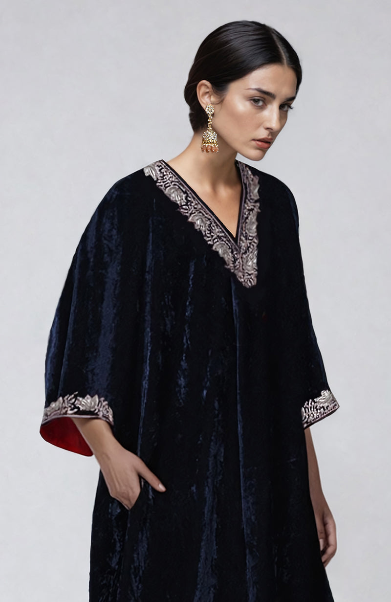 Midnight blue velvet kurta with silver tilla dozi embroidery and a red lining.