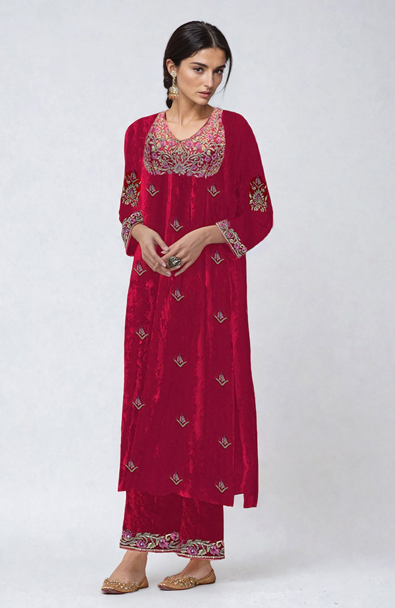 Ruby red velvet kurta set with resham, zari, and zardozi hand embroidery.