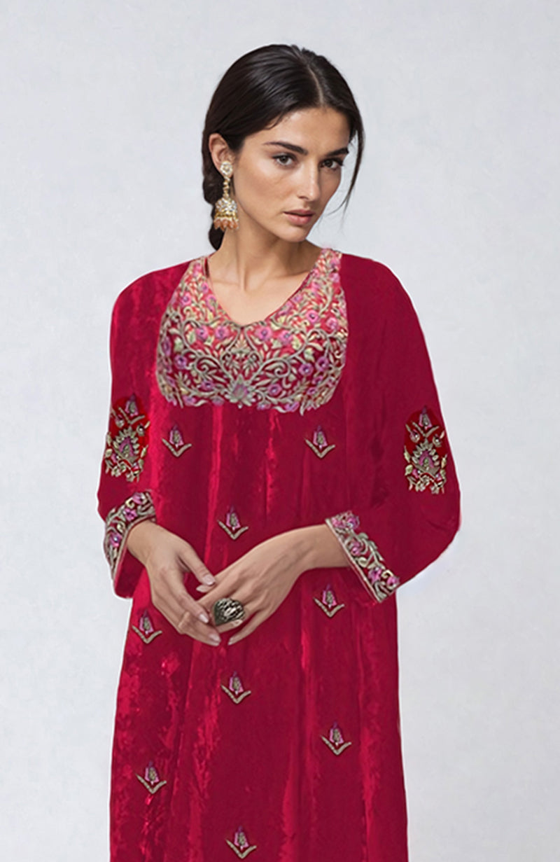 Ruby red velvet kurta set with intricate resham, zari, and zardozi embroidery.