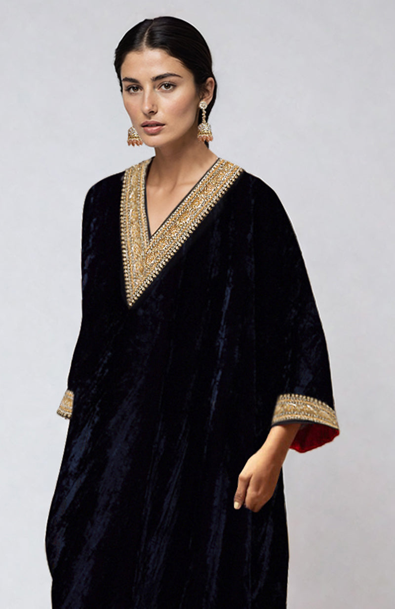 Midnight blue velvet kurta with gold beads and zardozi embroidery on the V-neckline and sleeves.