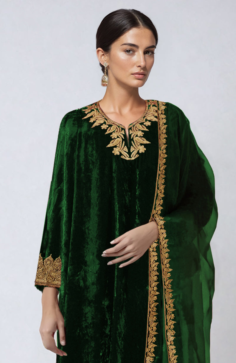 Emerald green velvet palazzo set with gold tilla aari embroidery.