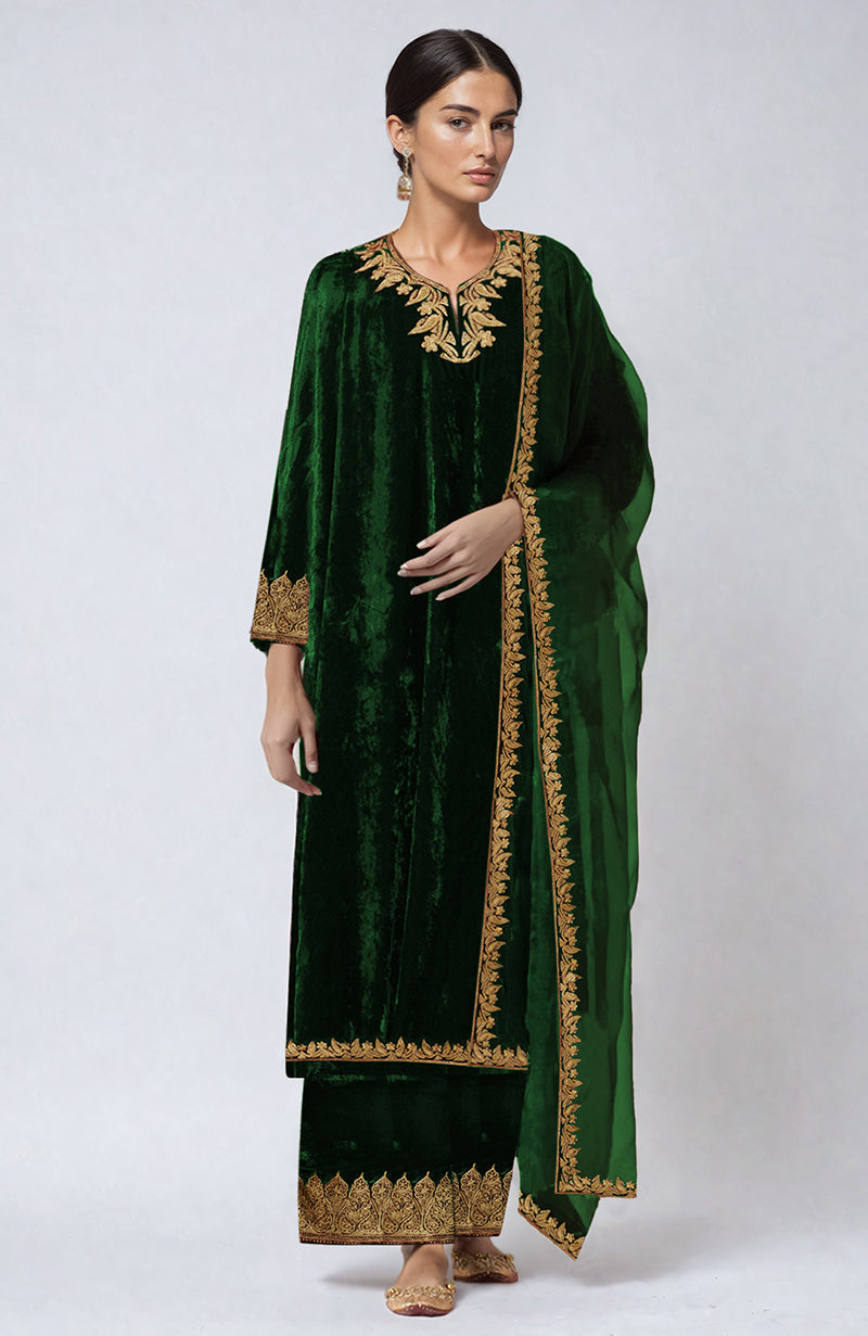 An emerald green velvet palazzo set with gold Kashmiri tilla aari embroidery.