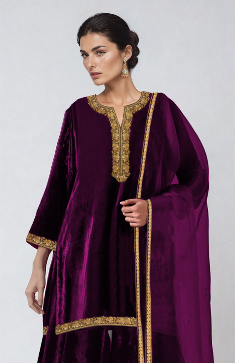 Peacock pink velvet sharara set with gold Tilla dozi embroidery and organza dupatta.