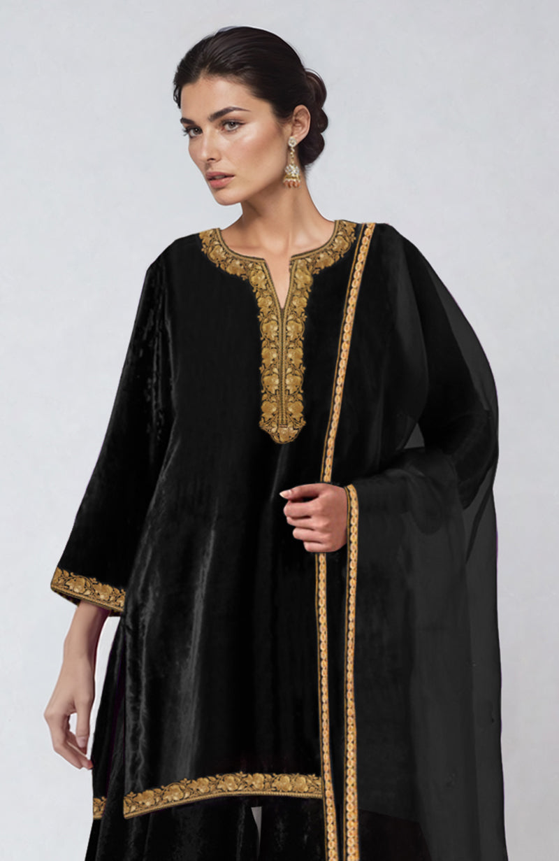 Black velvet sharara set with gold Kashmiri Tilla dozi embroidery.