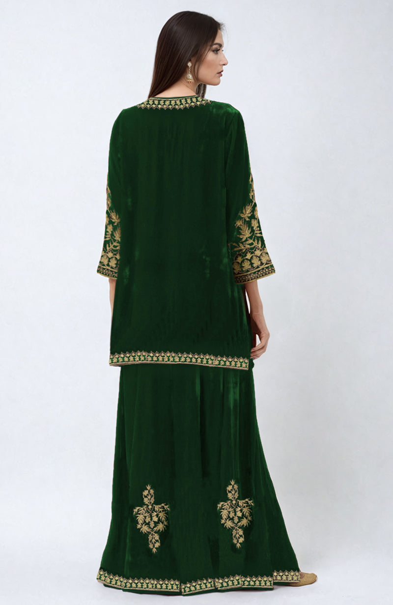 Emerald green velvet sharara set with gold Kashmiri tilla embroidery.