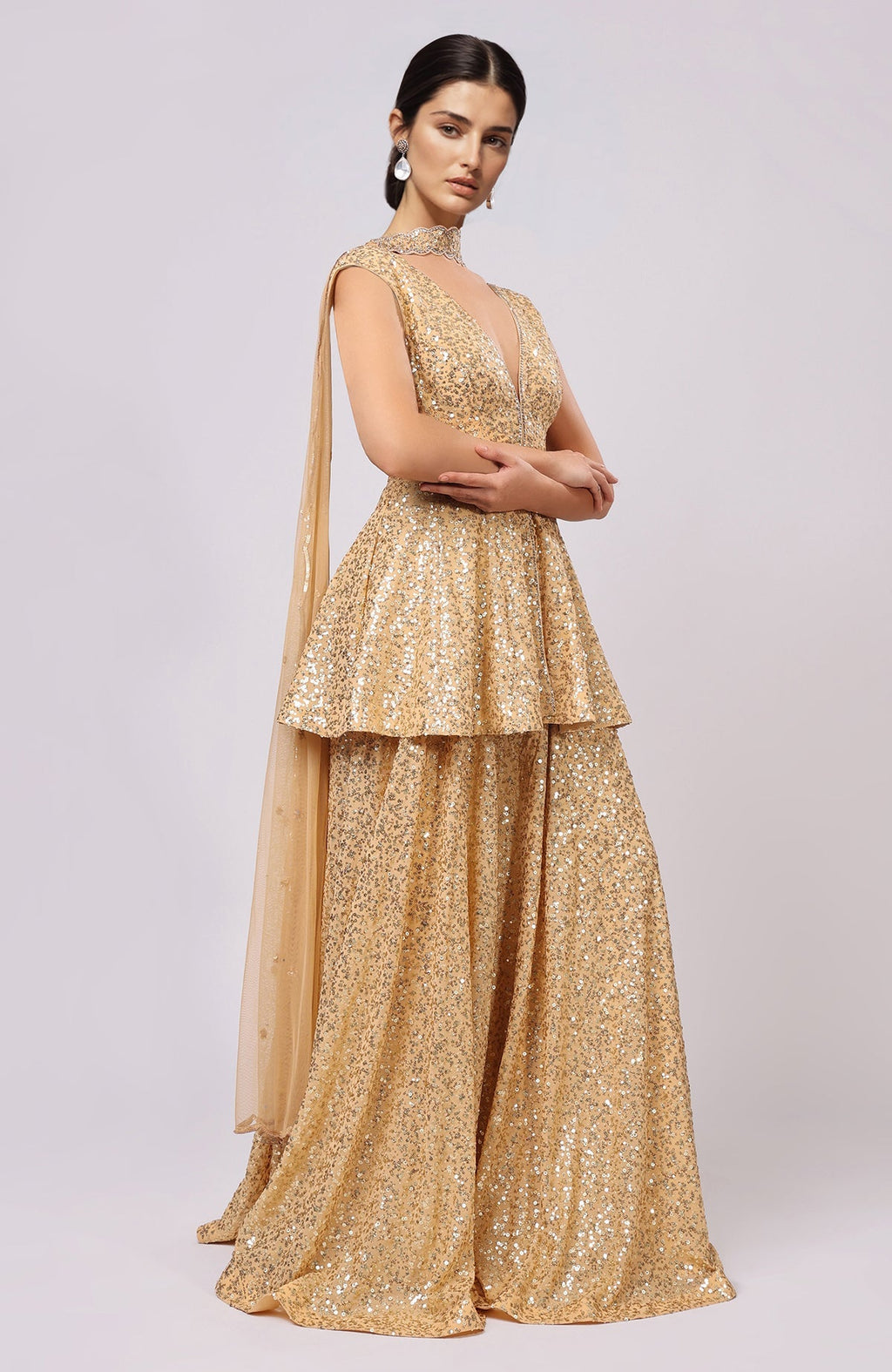 Gold sequined peplum top with flared sharara pants and embellished scalloped dupatta.