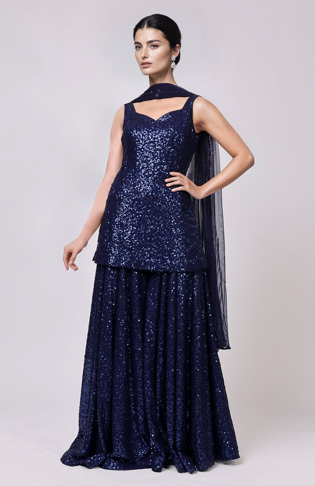 Sapphire blue sequined peplum top with sweetheart neckline and flared sharara pants with embellished dupatta