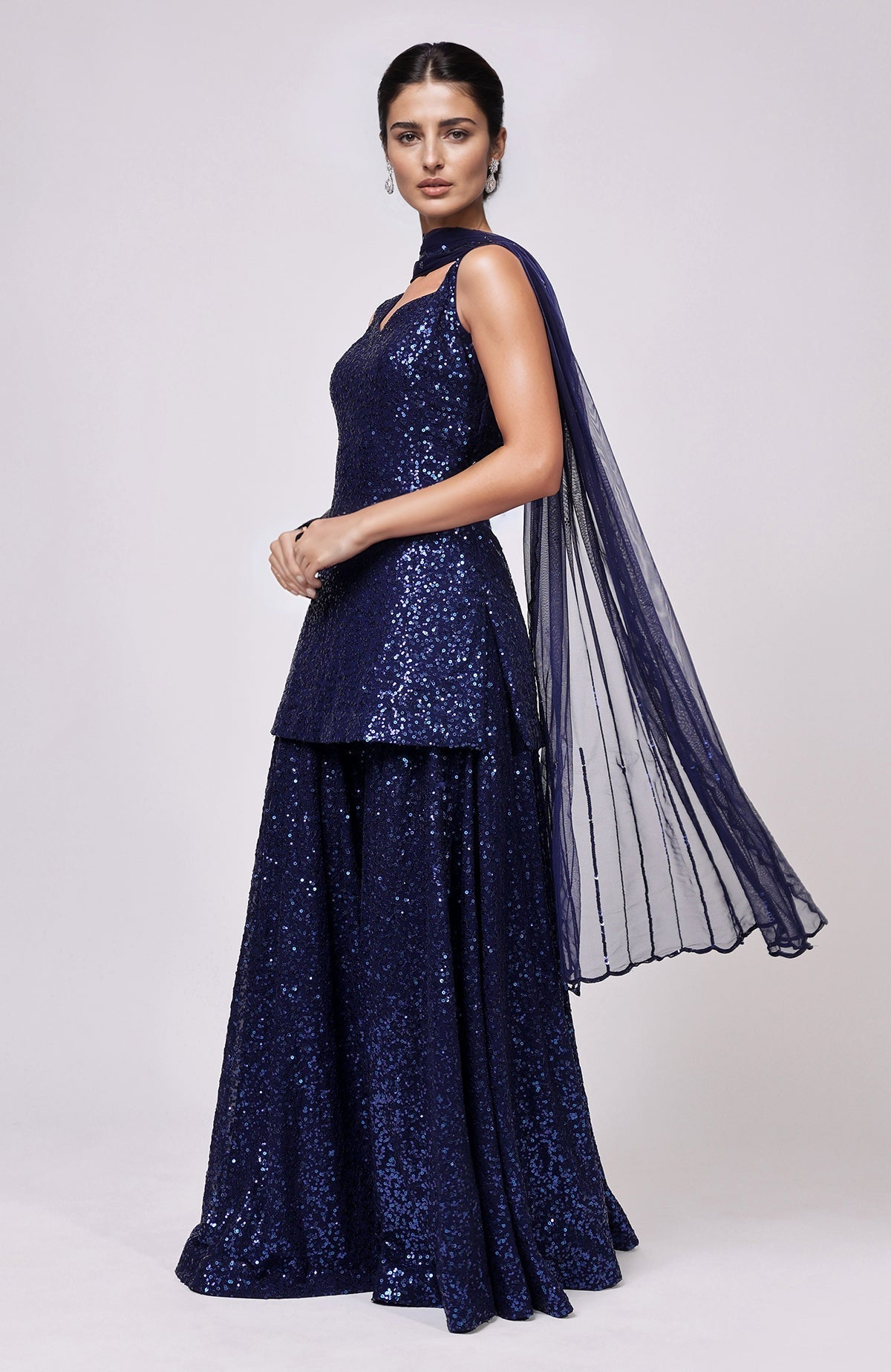 Sapphire blue sequined peplum top with flared sharara pants and embellished dupatta set