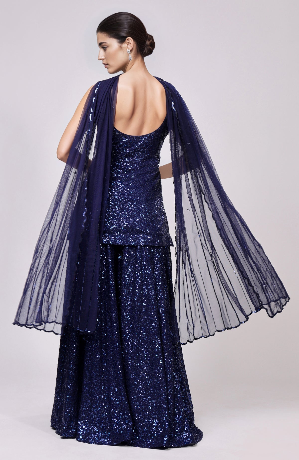 Sapphire blue sequin embroidered sharara set with a matching dupatta.