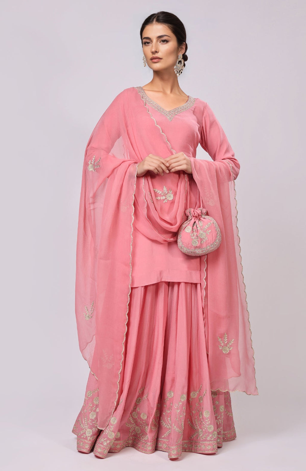 Pink Kashmiri Tilla Aari embroidered sharara set with a matching potli bag.