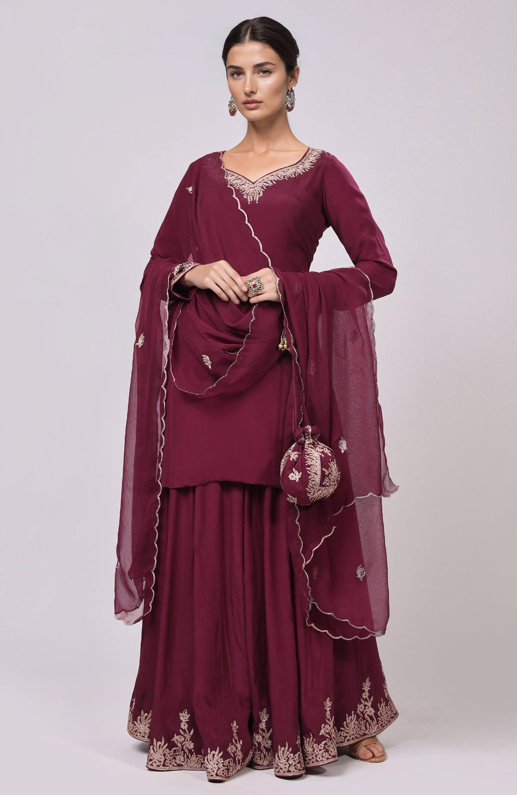 Burgundy Kashmiri Tilla Aari embroidered sharara set with matching potli bag.