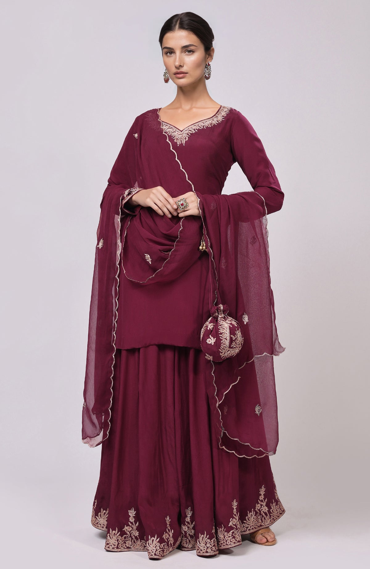 Burgundy Kashmiri Tilla Aari embroidered sharara set with matching potli bag.