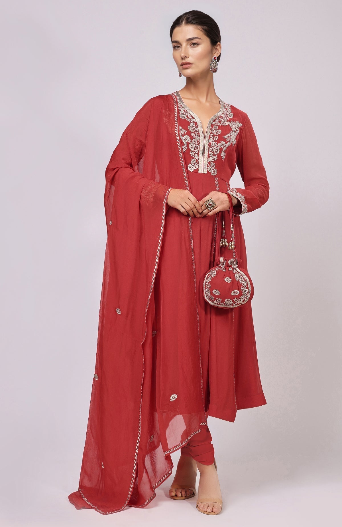 Red Anarkali set with Kashmiri Tilla Aari embroidery, sheer dupatta, and slim churidar.