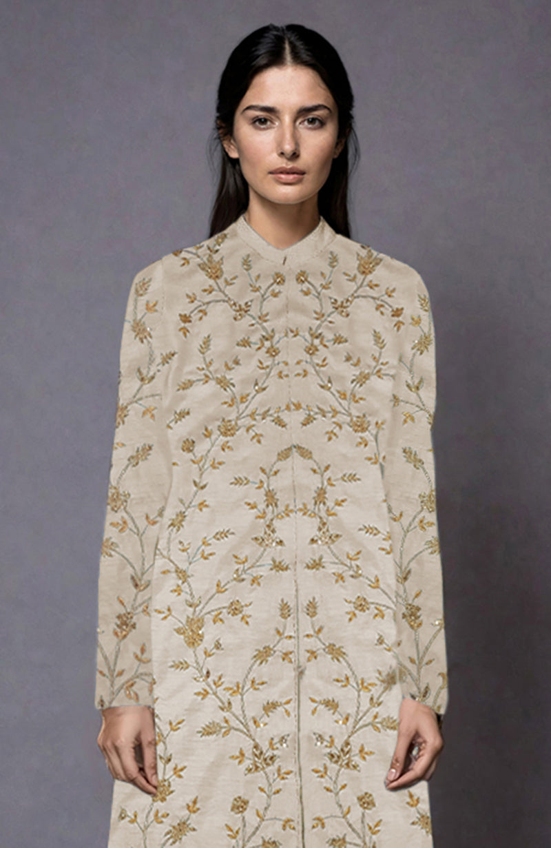 Light beige jacket with gold and silver floral zari and sequin embroidery.